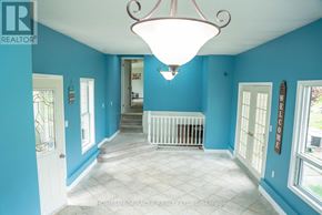 Mulmur apartment for rent - A foyer with a staircase and a chandelier.