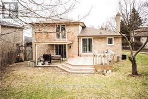 Toronto (Don Valley Village) apartment for rent - A house with a porch and a tree in front.