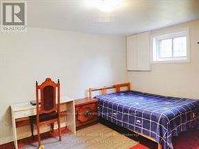 Toronto (Don Valley Village) apartment for rent - A bedroom with a bed, desk, and chair.