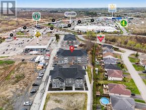 North Grenville multi-family for rent - A bird's eye view of a neighborhood with a Walmart in the background.