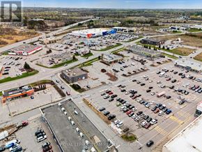 North Grenville apartment for rent - A parking lot with a large number of cars and a few buildings in the background.