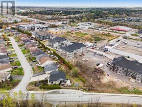 North Grenville multi-family for rent - A bird's eye view of a residential area with a road running through it.