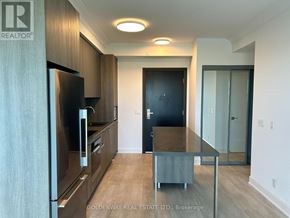 Markham (Unionville) condo for rent - A kitchen with a refrigerator, oven, and sink.