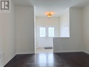 Markham (Wismer) townhouse for rent - A room with a white door and a window with white blinds.