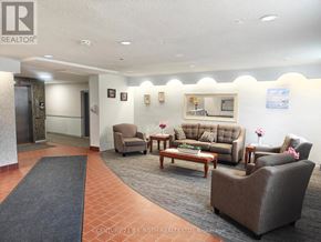 Barrie (Allandale) apartment for rent - A waiting area with a couch, chairs, and a coffee table.