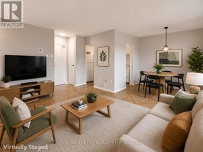 Barrie (Allandale) apartment for rent - A living room with a couch, chair, and coffee table.