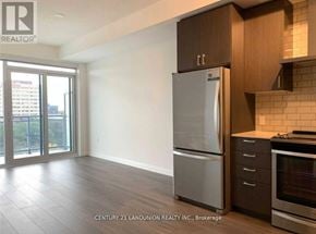 Toronto (Henry Farm) condo for rent - A kitchen with a refrigerator, oven, and stove.