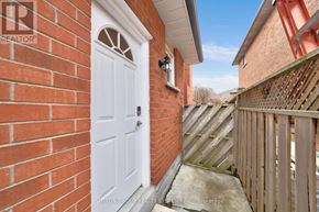Newmarket (Armitage) apartment for rent - A white door is on the left side of a brick wall.