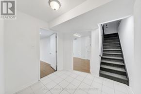 Newmarket (Armitage) apartment for rent - A hallway with a staircase leading to the second floor.
