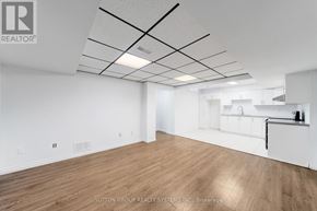 Newmarket (Armitage) apartment for rent - A spacious room with wooden flooring and white walls.