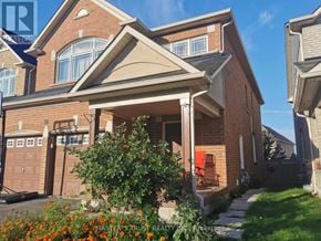 East Gwillimbury apartment for rent - A house with a red chair on the porch.