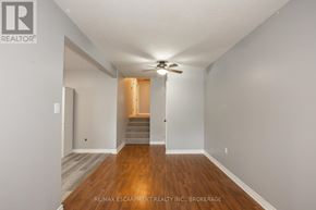 Welland (Lincoln/Crowland) apartment for rent - A room with a wooden floor and a ceiling fan.