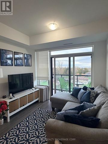 Barrie (Painswick South) condo for rent - A living room with a television and a couch.
