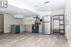 Haldimand apartment for rent - A kitchen with a blue refrigerator and stove.
