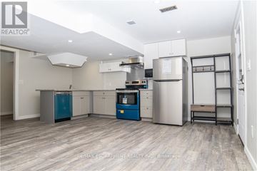 Haldimand apartment for rent - A kitchen with a blue refrigerator and stove.