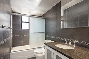 New York apartment for rent - a bathroom with a sink toilet and shower