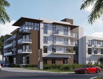 Miami apartment for rent - A red sports car is parked on the street in front of a modern apartment building.