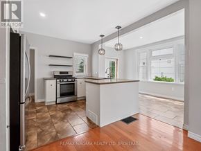 Fort Erie (Ridgeway) apartment for rent - A kitchen with a refrigerator, oven, and sink.