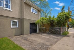 Ottawa apartment for rent - A house with a garage and a sign that says "REALTOR".