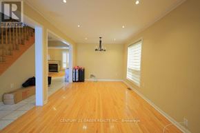 Toronto (Rouge) apartment for rent - A room with wooden floors and a chandelier is shown.