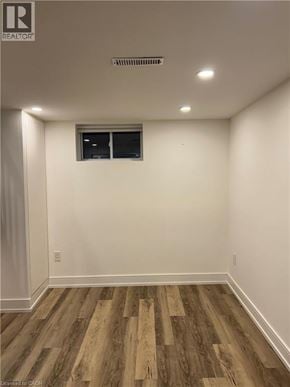 Hamilton apartment for rent - A room with wooden flooring and a window.