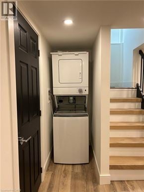 Hamilton apartment for rent - A white dishwasher is in a narrow hallway.