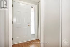 Ottawa townhouse for rent - A white door with a glass window is in a room with white walls.