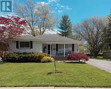 Welland (N. Welland) apartment for rent - A white house with a red tree in front of it.