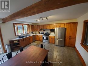 Collingwood apartment for rent - A kitchen with wooden cabinets and a large island.