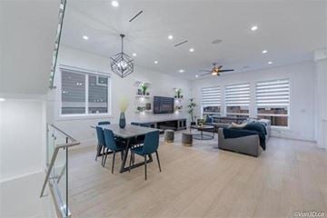Surrey apartment for rent - A modern living room with a dining table and chairs.