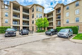 Burlington (Uptown) condo for rent - A parking lot with several cars and apartment buildings in the background.