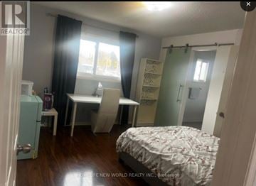 Mississauga (Erin Mills) apartment for rent - A bedroom with a bed, desk, and chair.