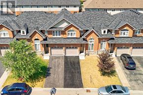 Hamilton townhouse for rent - A row of houses with cars parked in front.