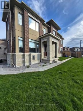 Whitby apartment for rent - A modern two-story house with a large front yard.