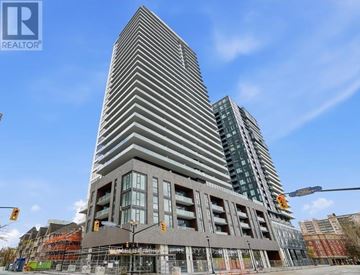 Burlington (Brant) condo for rent - A tall building with a modern design is under construction.