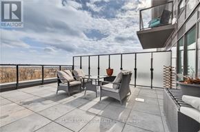 Hamilton (Waterdown) condo for rent - A balcony with chairs and a table is shown.