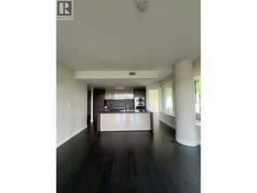 West Vancouver apartment for rent - A spacious kitchen with dark wood floors and white walls.