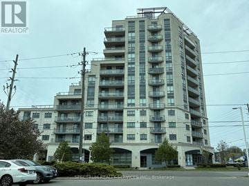 Vaughan (Vaughan Grove) condo for rent - A large apartment building with Spectrum Realty Services Inc. written on the front.
