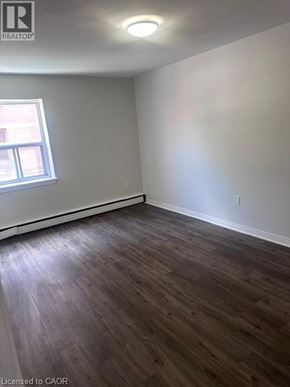 Hamilton apartment for rent - A room with wooden flooring and a window.