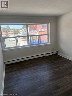 Hamilton apartment for rent - Empty room with a window overlooking a street.