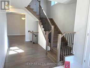 Peterborough (Monaghan Ward 2) apartment for rent - A staircase with a wooden handrail and a metal balustrade.