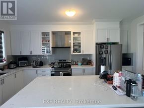 Peterborough (Monaghan Ward 2) apartment for rent - A kitchen with a large island in the middle.