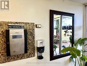 St. Catharines (Glendale/Glenridge) condo for rent - A wall with a no smoking sign and a parking meter.