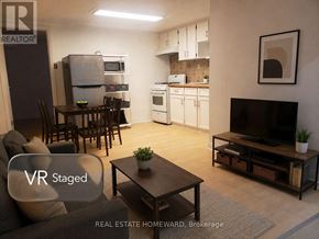 Toronto (Dovercourt-Wallace Emerson-Junction) apartment for rent - A living room with a VR Staged sign.