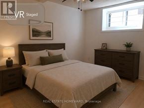 Toronto (Dovercourt-Wallace Emerson-Junction) apartment for rent - A bedroom with a bed, nightstand, and dresser.