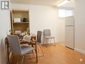 Toronto (Steeles) apartment for rent - A small room with a table and chairs.
