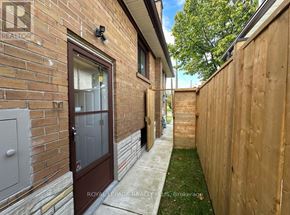 Toronto (Markland Wood) apartment for rent - A brown door is on a brick building.