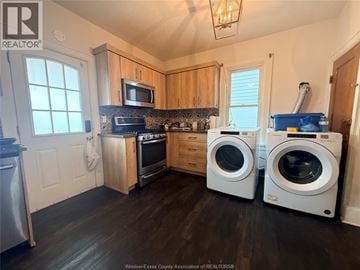 Windsor apartment for rent - A kitchen with wooden cabinets and a microwave above the stove.