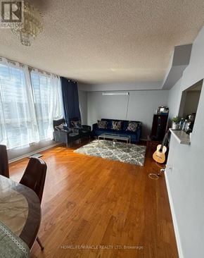 Toronto (Mount Olive-Silverstone-Jamestown) house for rent - A living room with a guitar on the floor.