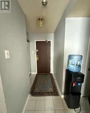 Toronto (Mount Olive-Silverstone-Jamestown) house for rent - A hallway with a door and a water cooler.